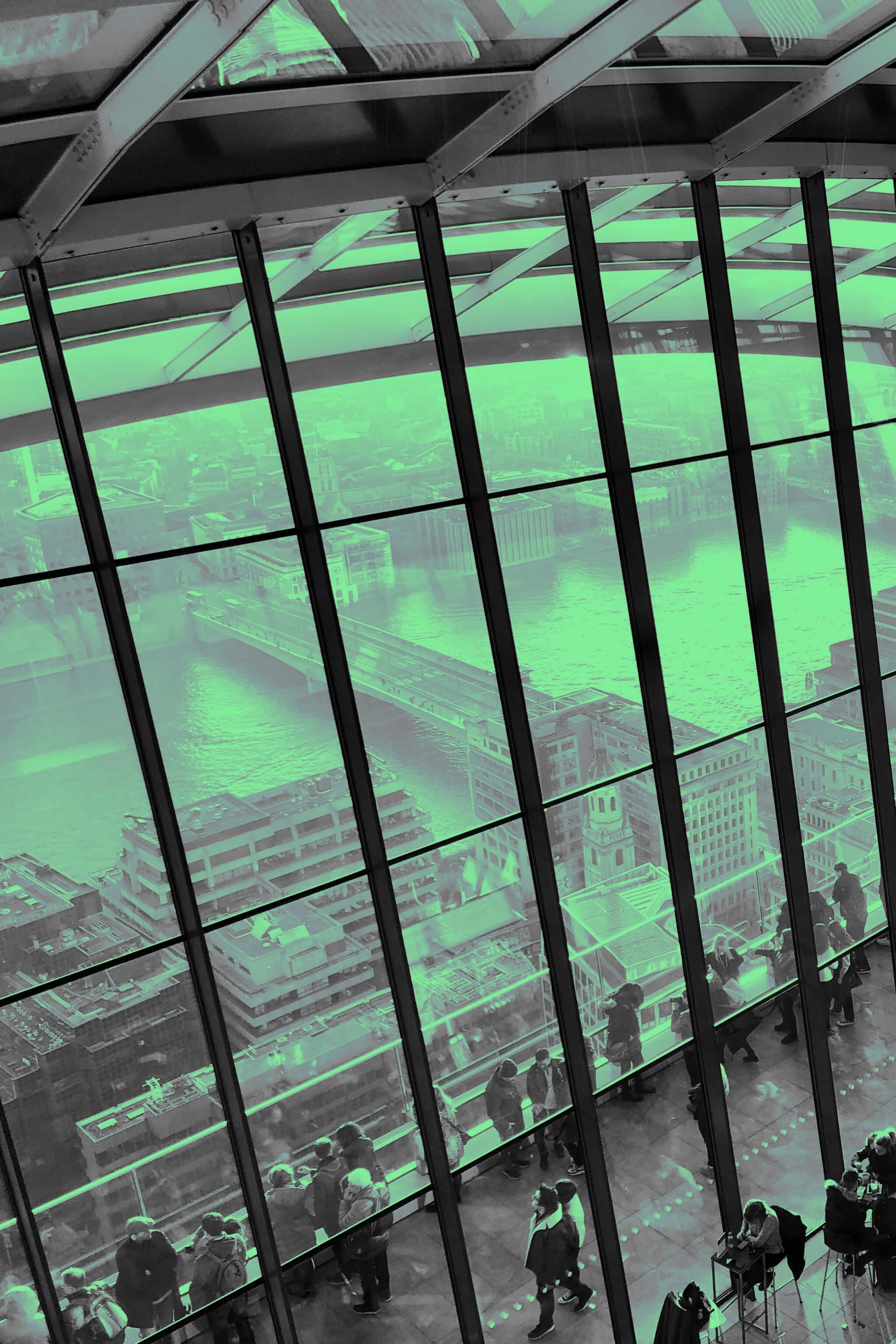 Panoramic view of people talking at the Sky Garden in London.